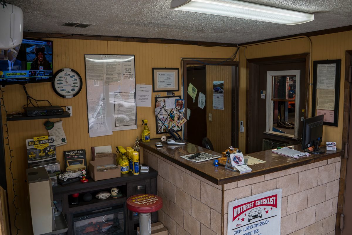 The wood-paneled front office with the customer counter